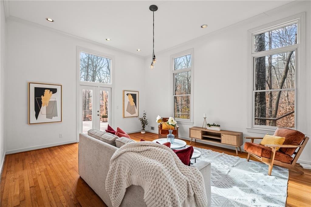 Sunny sunken living room with hardwoods