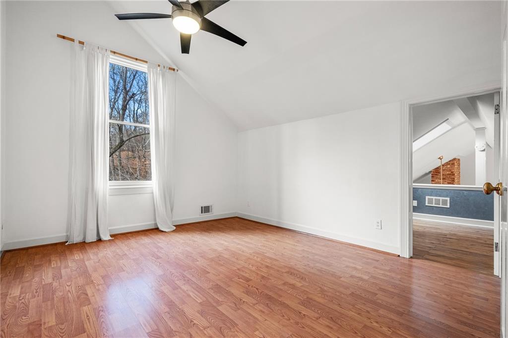 Bedroom 3 with loft space overlooking living and dining areas