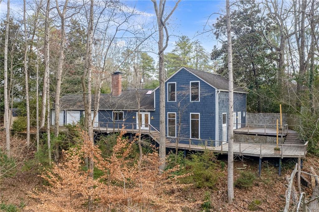 Back of property featuring decks