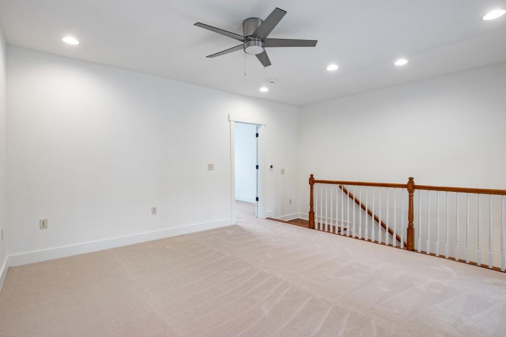 Up one more floor you'll be delighted by a large den, second guest bedroom with full bath, and the incredible rooftop terrace!