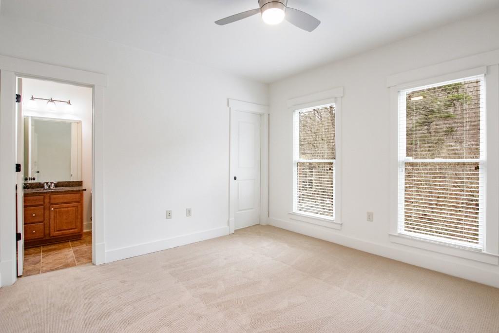 Top level guest bedroom with full bath.