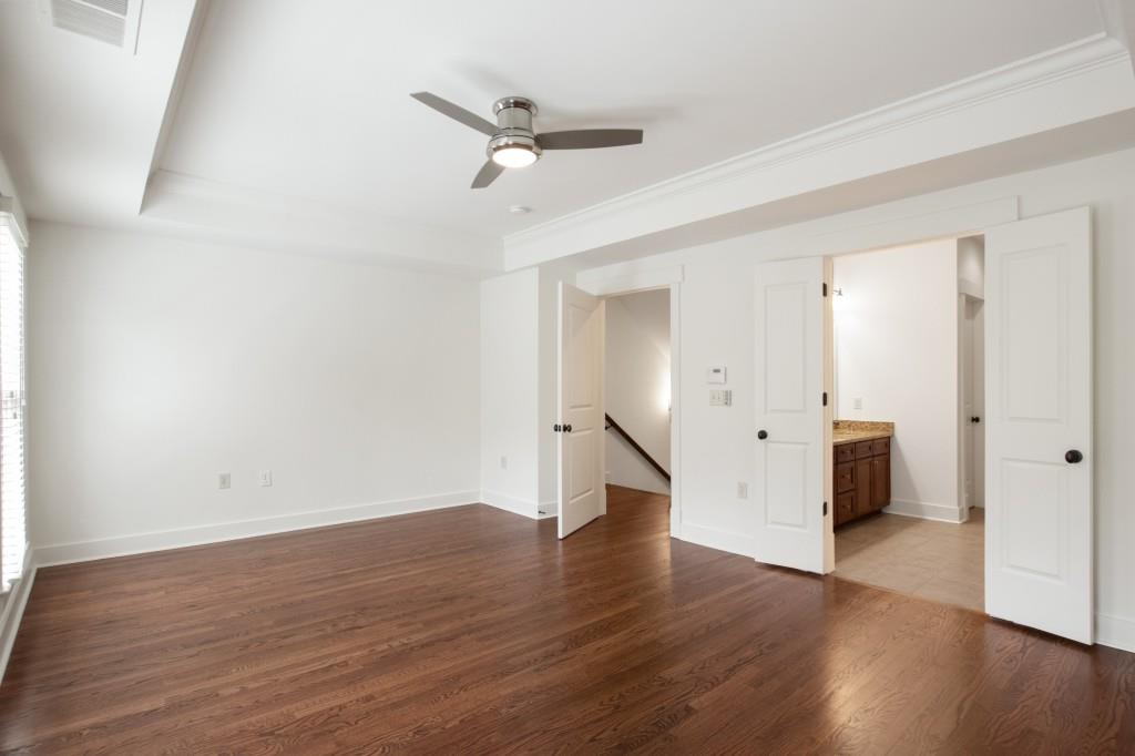 Upstairs you'll find the large primary suite, complete with trey ceiling, spacious en suite, and large custom closet.