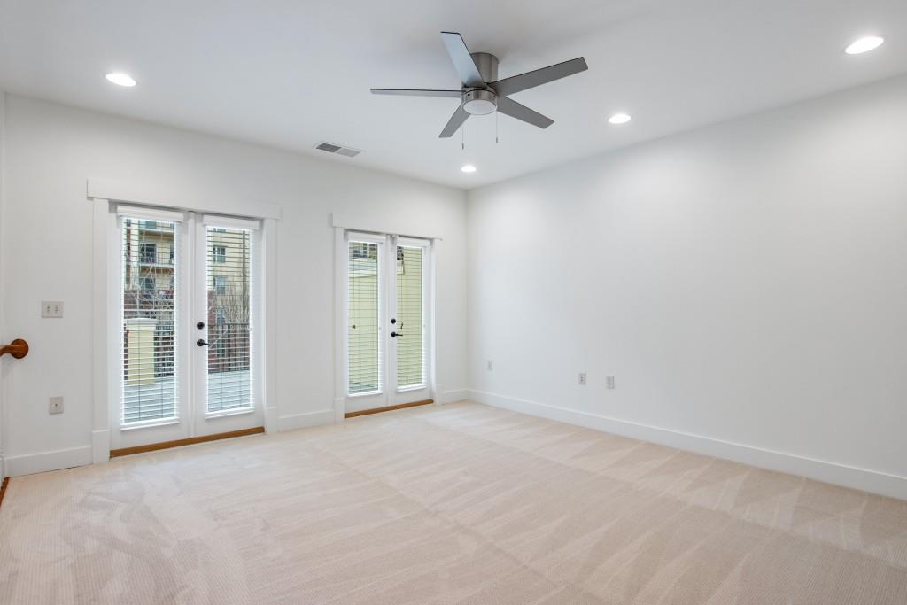 Two sets of French doors lead to one of the most coveted home features in the neighborhood, the rooftop terrace.