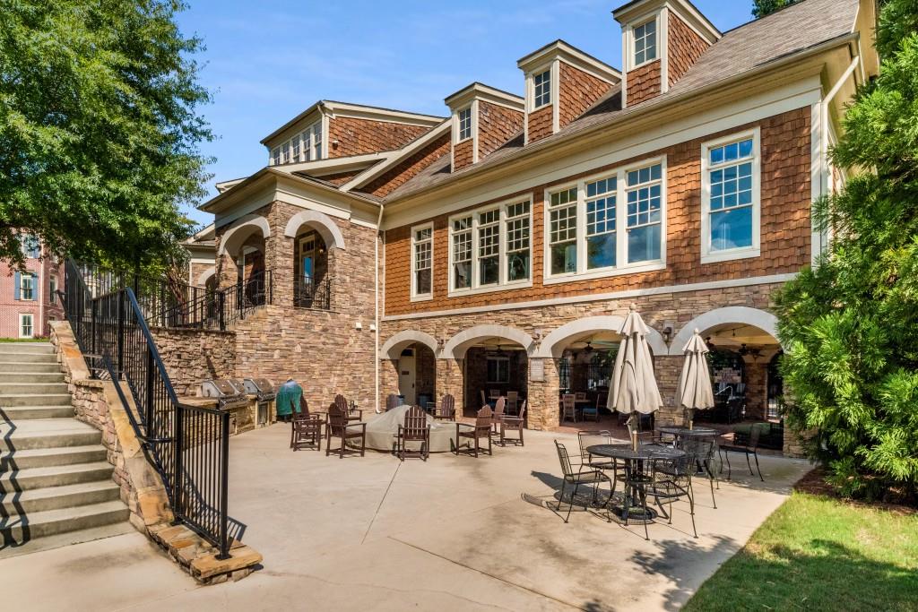 The lower level of the Meeting House has a covered pavilion and a fire pit, gas grills, and Big Green Egg for resident use.