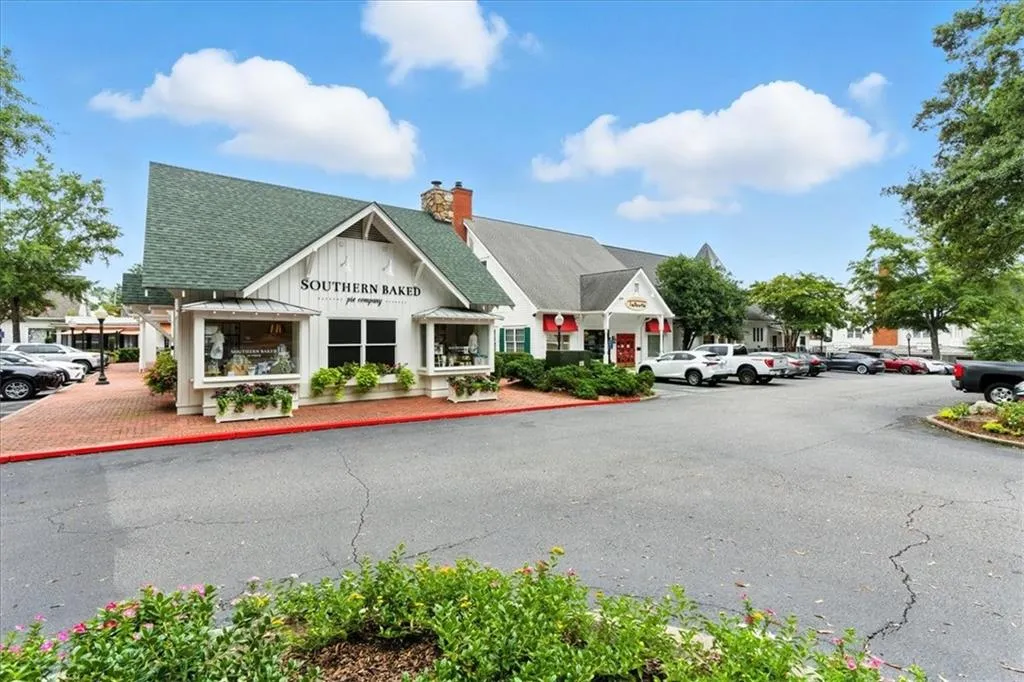 View of property with uncovered parking