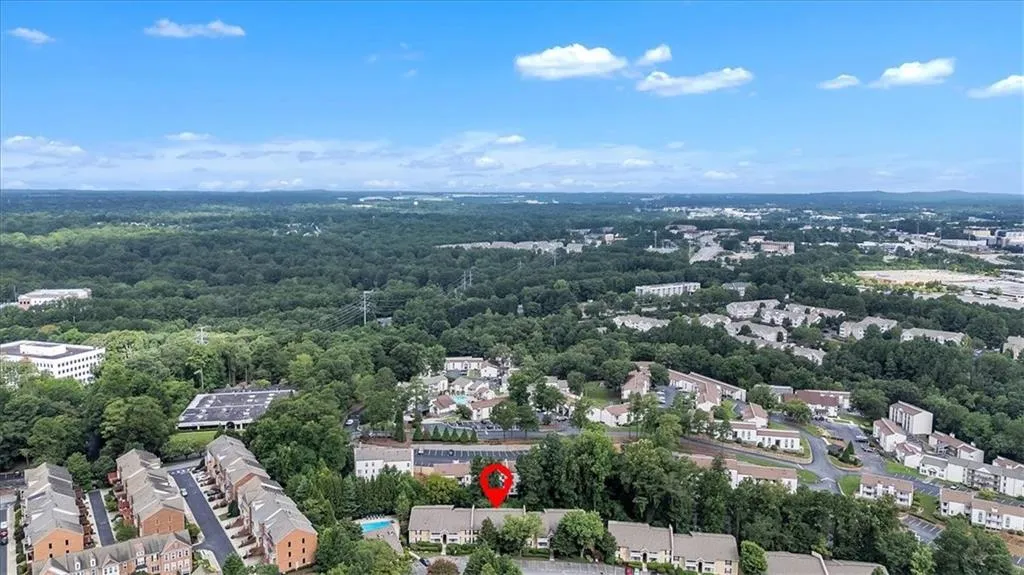 Aerial perspective of suburban area with a heavily wooded area
