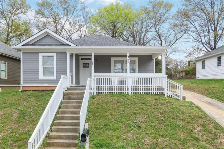 Gray horizontal siding exterior with white trim