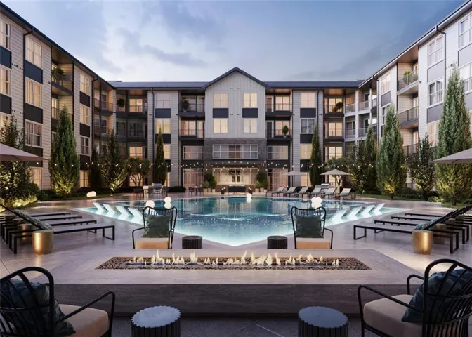 View of pool featuring a patio area and a fire pit