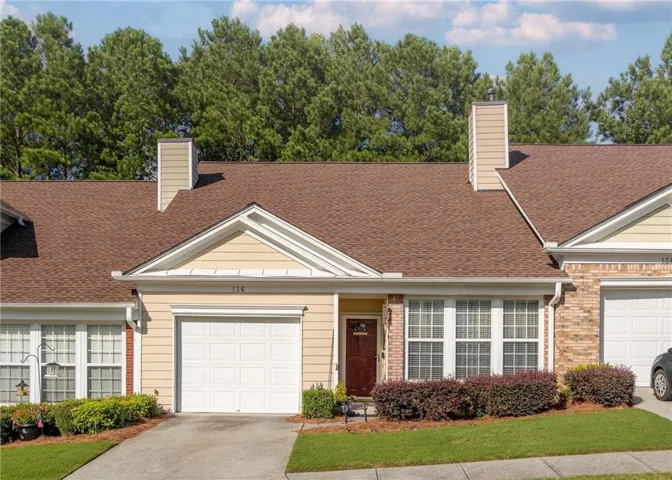 Single-car garage with a paved driveway