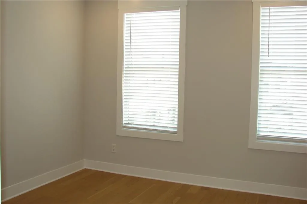 Secondary bedroom with wood finished floors