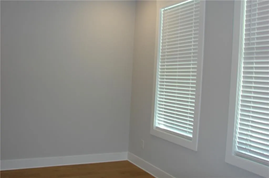 Lower level 3rd bedroom/office featuring light wood-type flooring