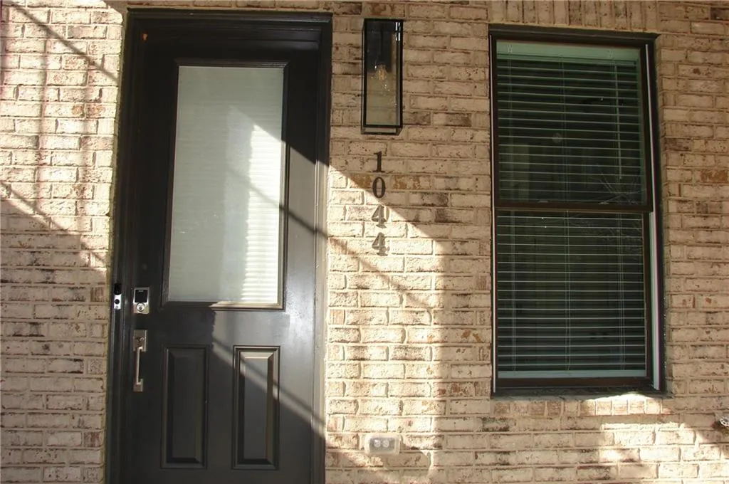 Property entrance with brick siding
