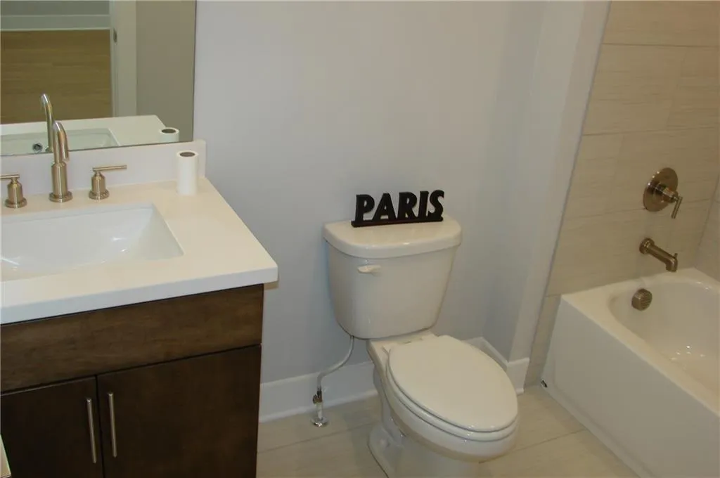 Secondary full bathroom featuring vanity and bathtub / shower combination