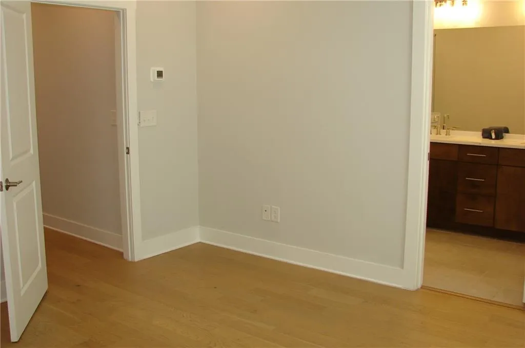 Primary bedroom with view to primary bath.