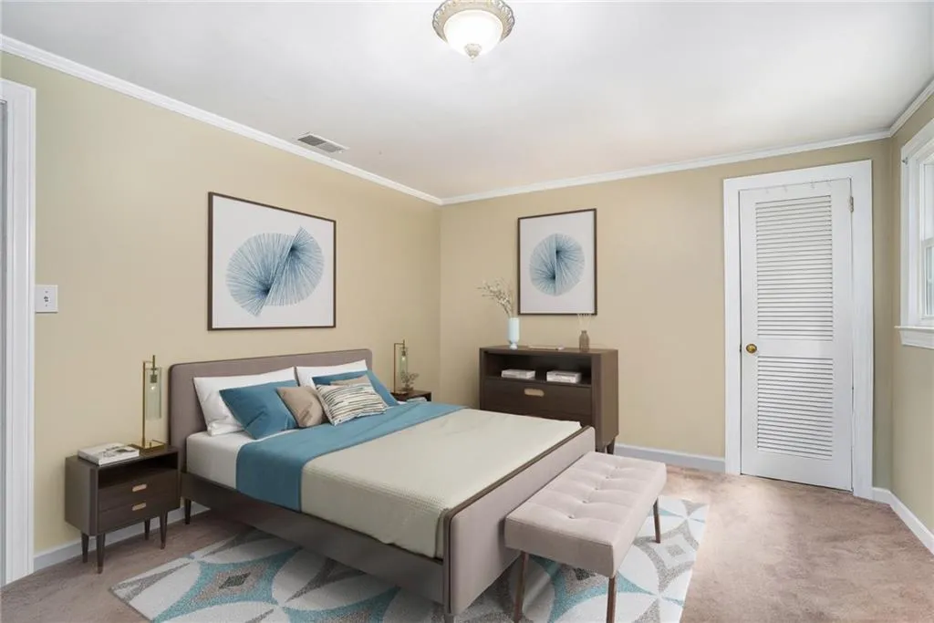 Bedroom with light carpet and ornamental molding Virtually Staged
