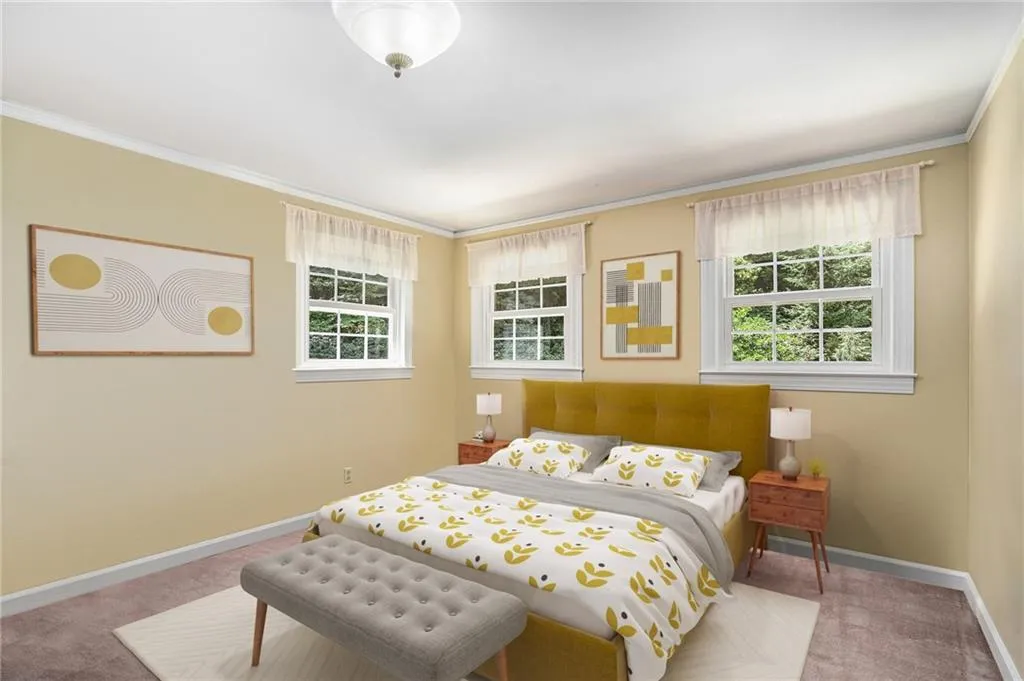 Bedroom with crown molding and carpet flooring Virtually Staged