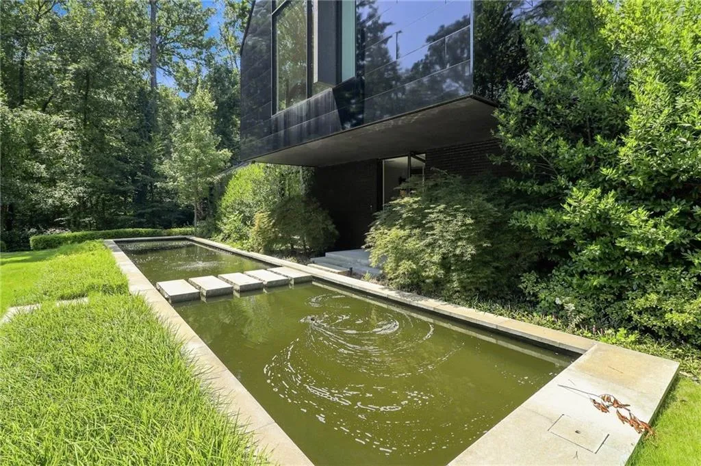Modern exterior with a dark-toned facade and expansive windows