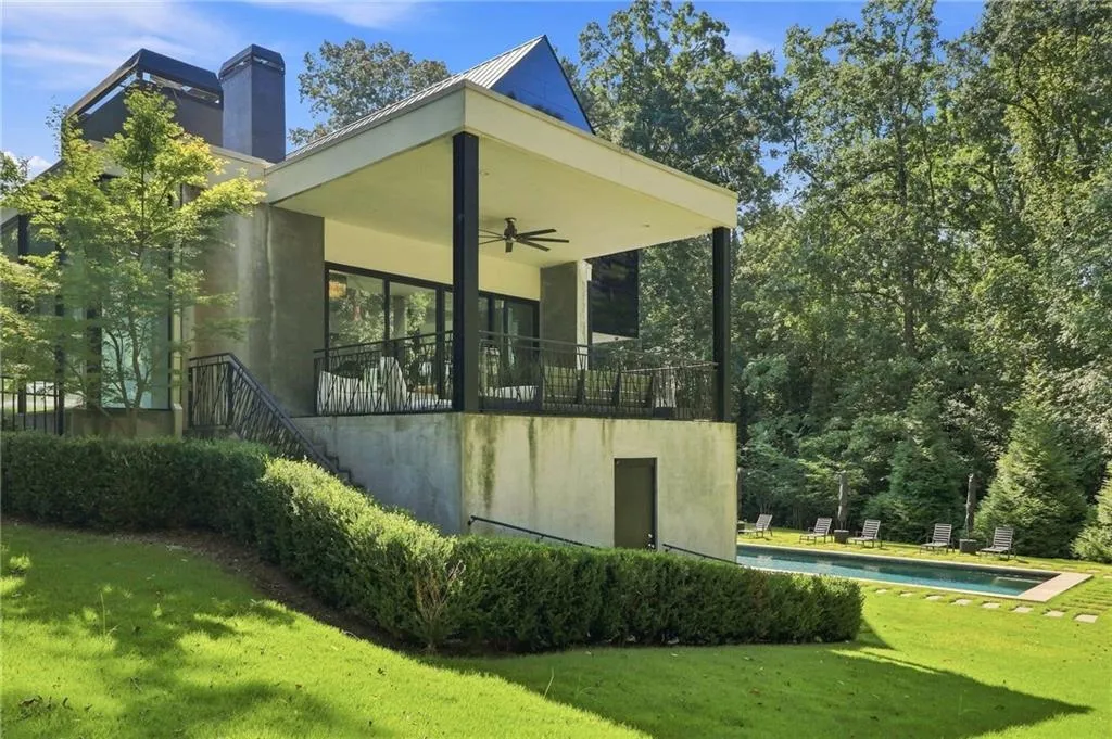 Expansive backyard with a rectangular swimming pool and stepping stones