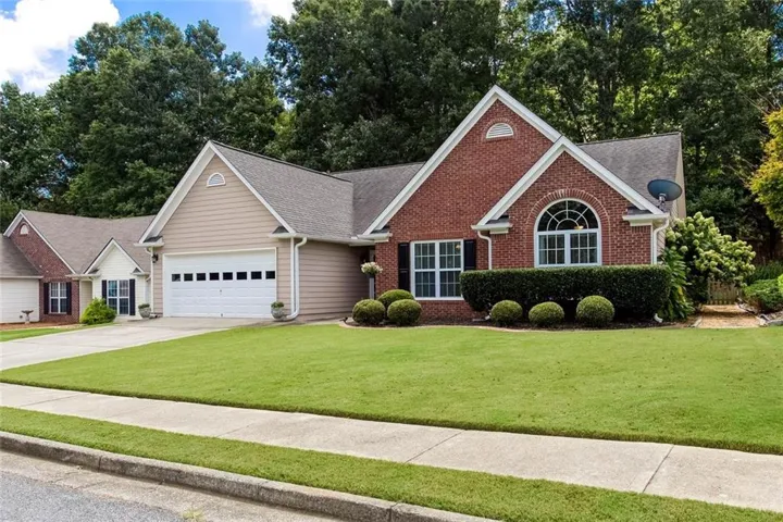 Brick and siding exterior with a gabled roof