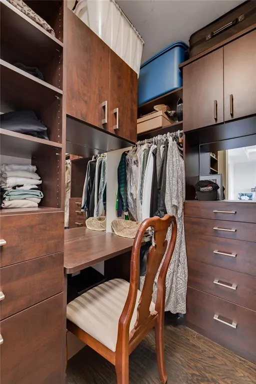 Built - in drawers, velvet lined jewelry drawers(2), built in hamper, small ironing board, vanity area and huge double shoe closet. Double door mirrors plus custom hanging space and shelves.