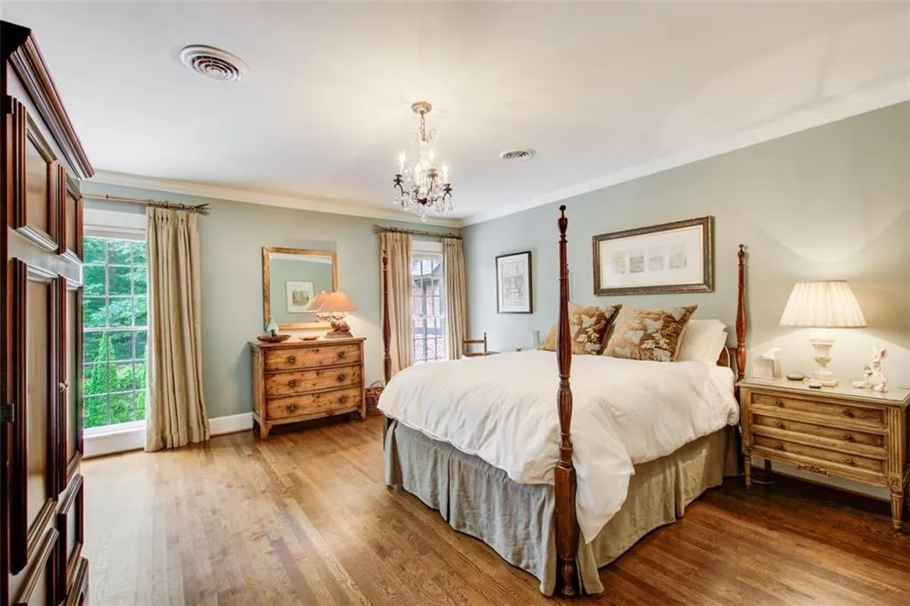 4 bedrooms upstairs this is one of the guest rooms. Beautiful hardwood flooring throughout this home.