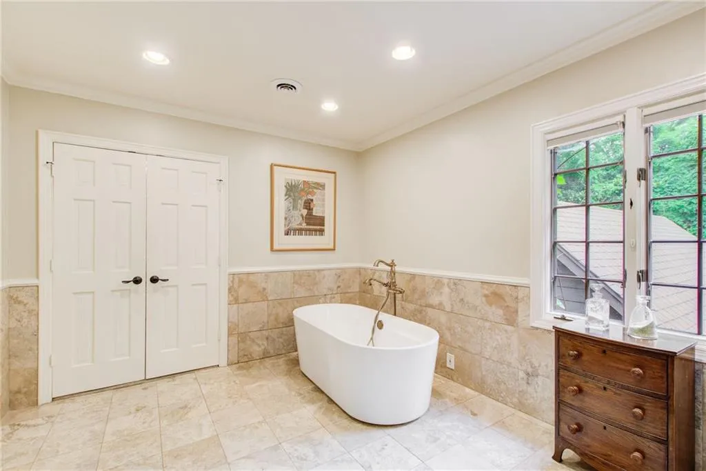 Free standing tub and views of the gardens.