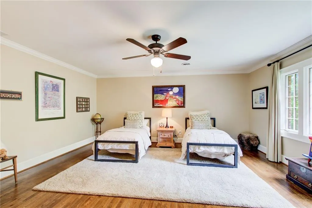 All 4 bedrooms upstairs are full of light and spacious. This  is one of the guest bedrooms.