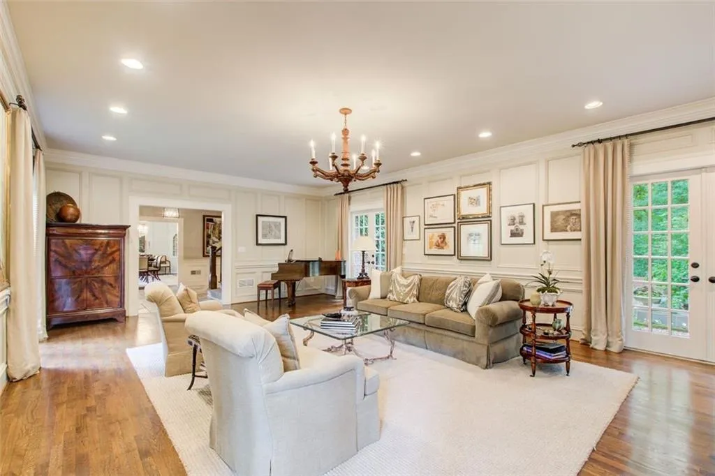 Spacious fireside  living room with 2 sets of French doors