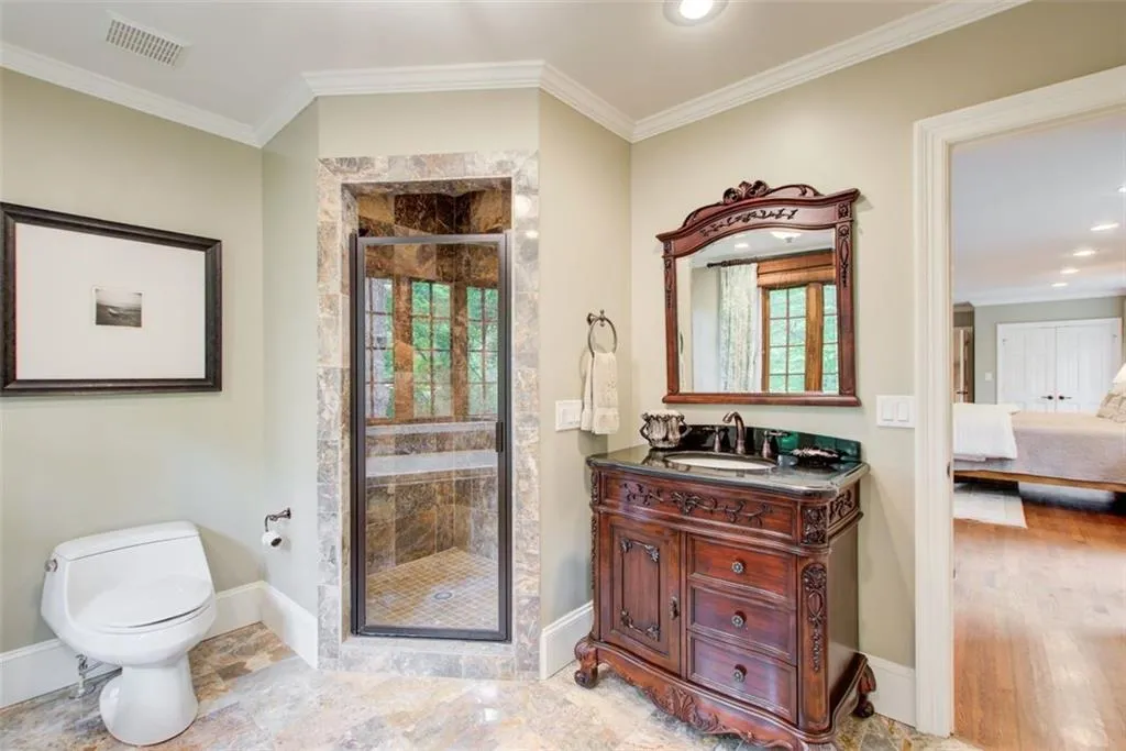 Primary number 2 bathroom with separate tub and shower.