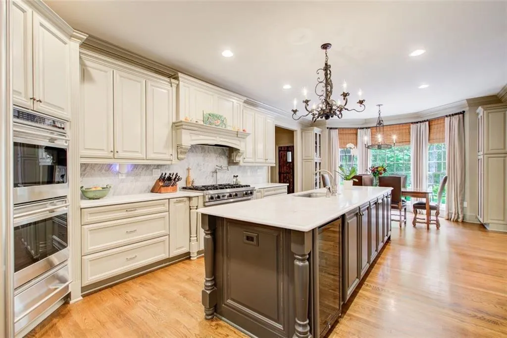 Plenty of room for multiple chefs in this kitchen. Wolf double ovens and warming drawer, Bosch gas cooktop.