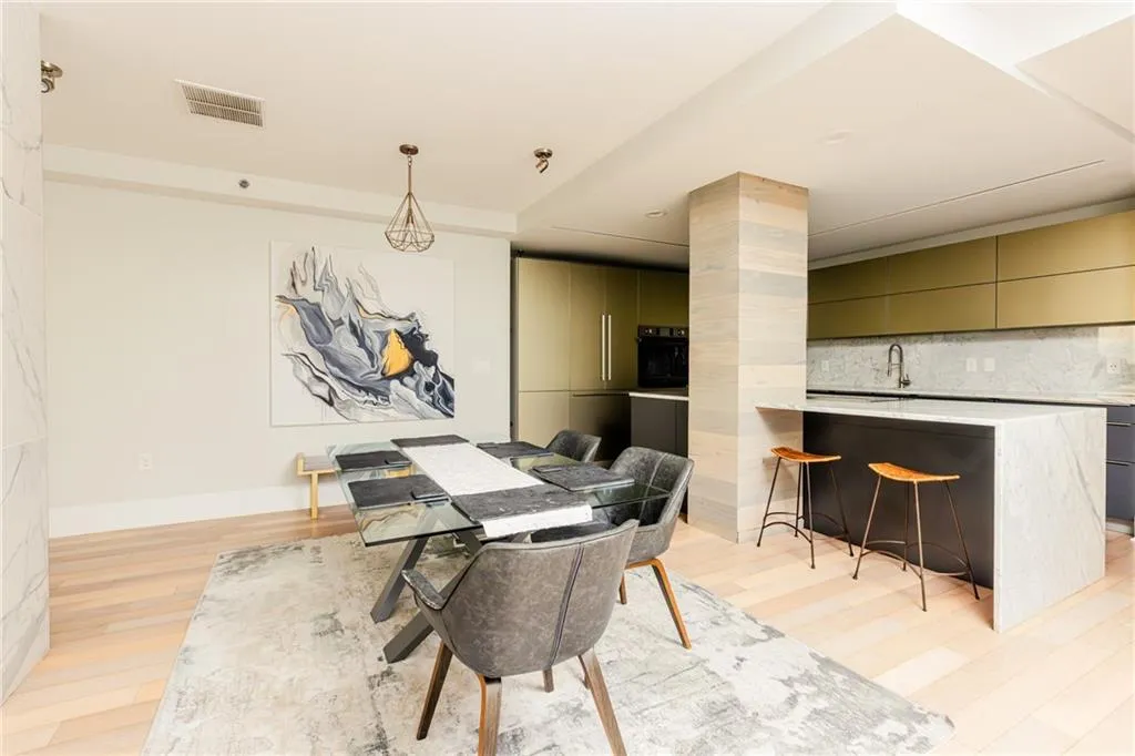 Dining room with light wood-style flooring and baseboards