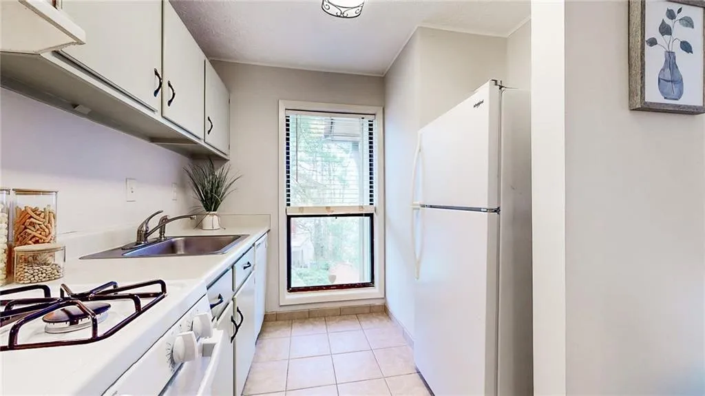 Natural light in the kitchen from this floor to ceiling window
