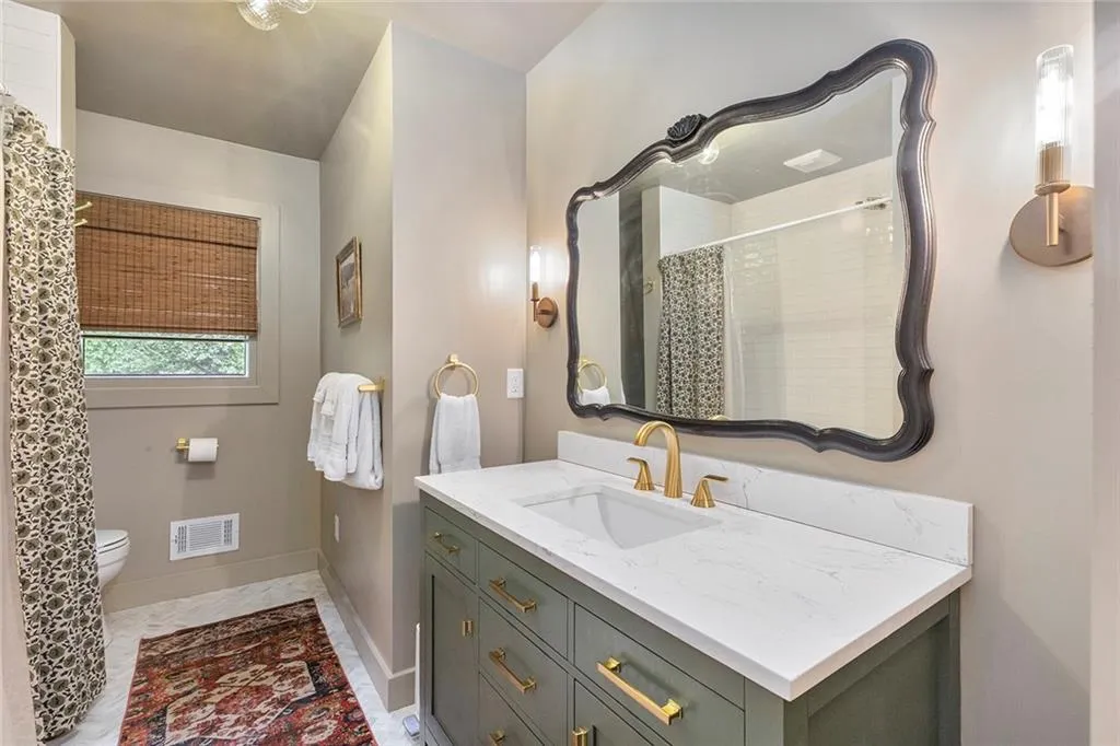 Full bath featuring vanity and a shower with curtain