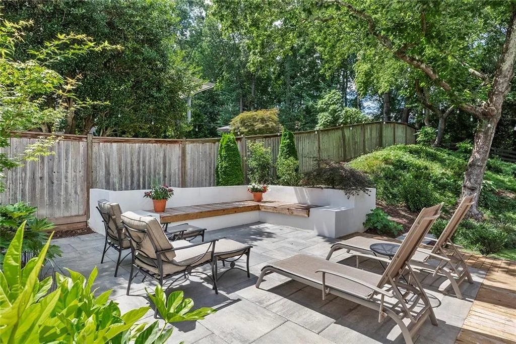 Fenced backyard featuring a patio