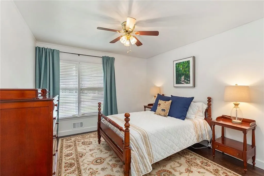 Bedroom featuring light wood-type flooring and a ceiling fan