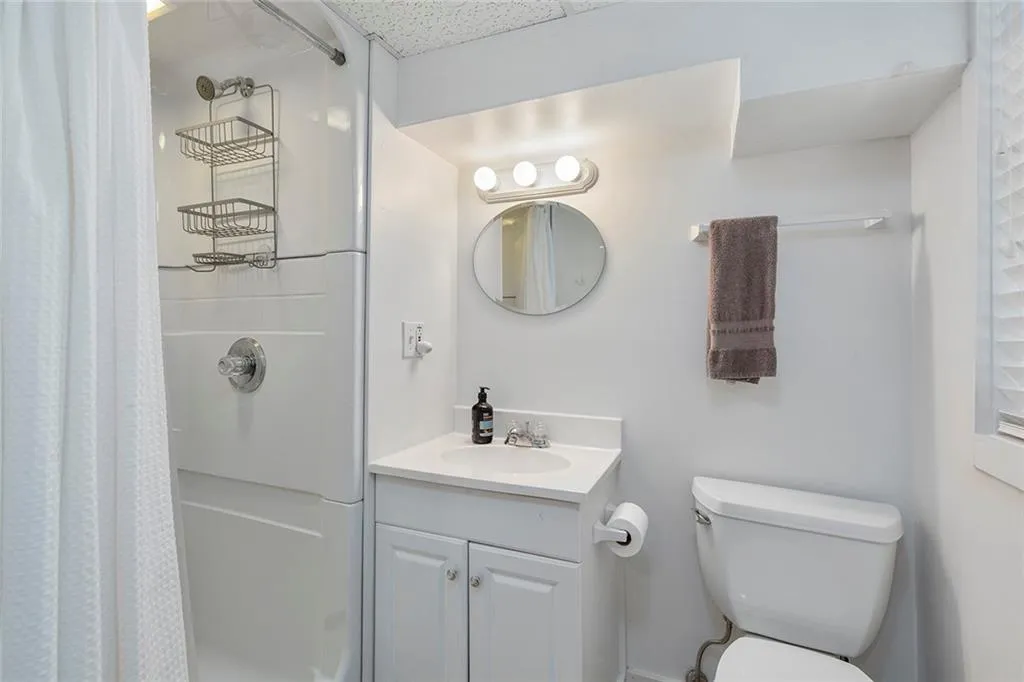 Bathroom featuring vanity and a shower with shower curtain