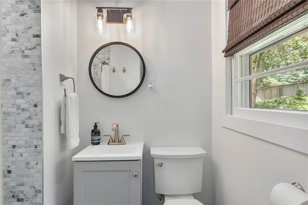 Bathroom featuring vanity and a shower with curtain