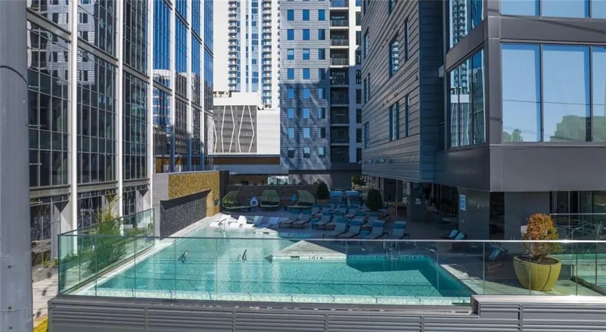 Community pool with a patio