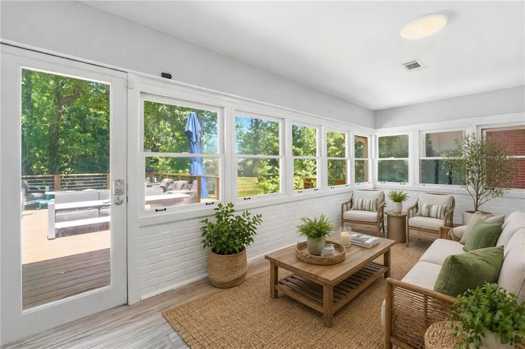 Enjoy Natural Light Overlooking the Backyard in this Sun Room