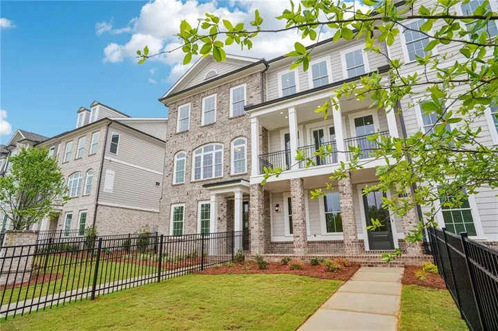 Home will have a fenced in front yard - very rare for a townhome - pictures represent a previously built home