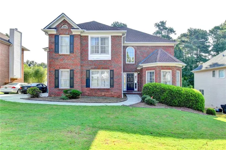 Brick exterior with multiple gables and a turret