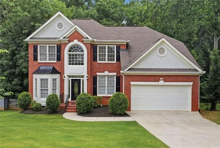 This home has an elegant street view while maintaining family privacy