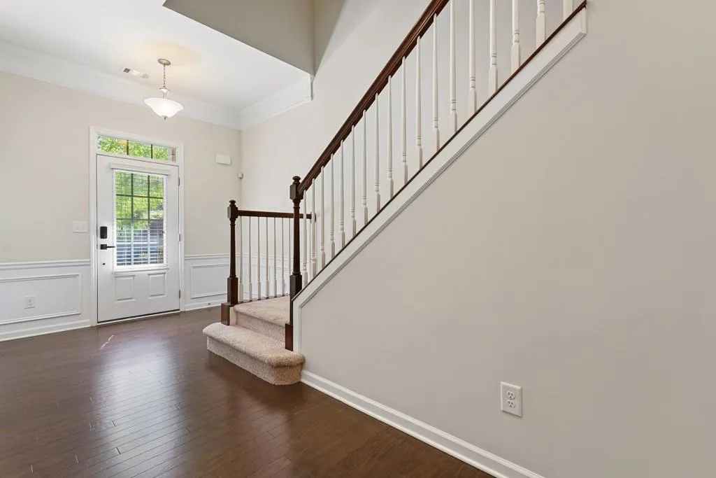 Beautiful 2 story entry foyer and handsome staircae