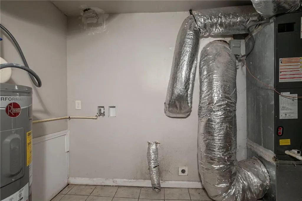 Utility room with electric water heater