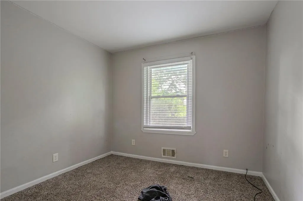 Unfurnished room featuring carpet floors