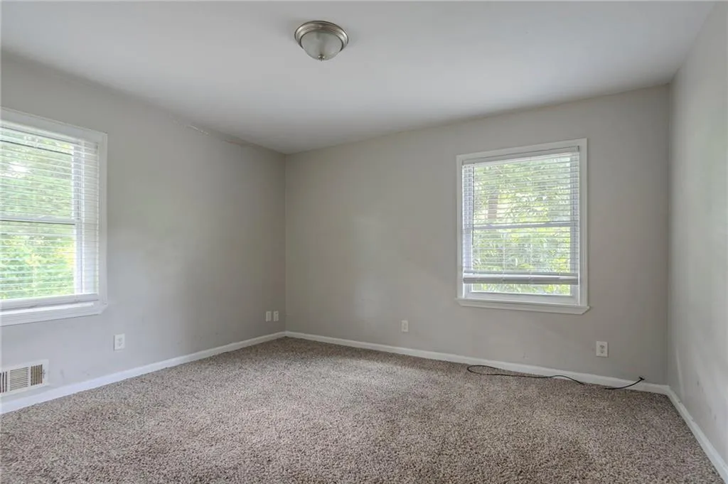 Empty room featuring carpet