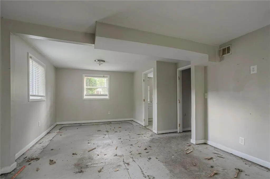 Spare room featuring baseboards