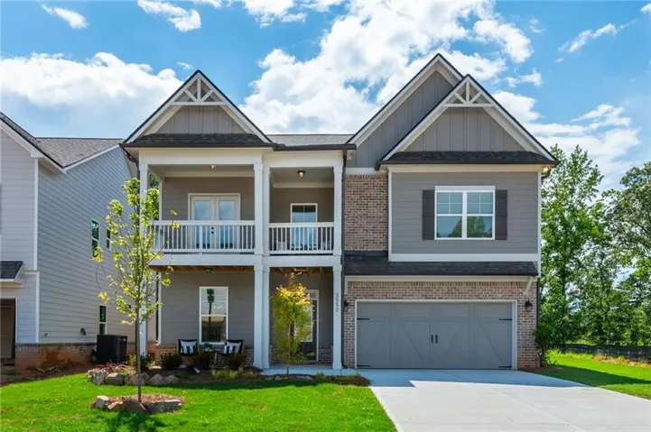 Two-story exterior with a combination of brick and siding