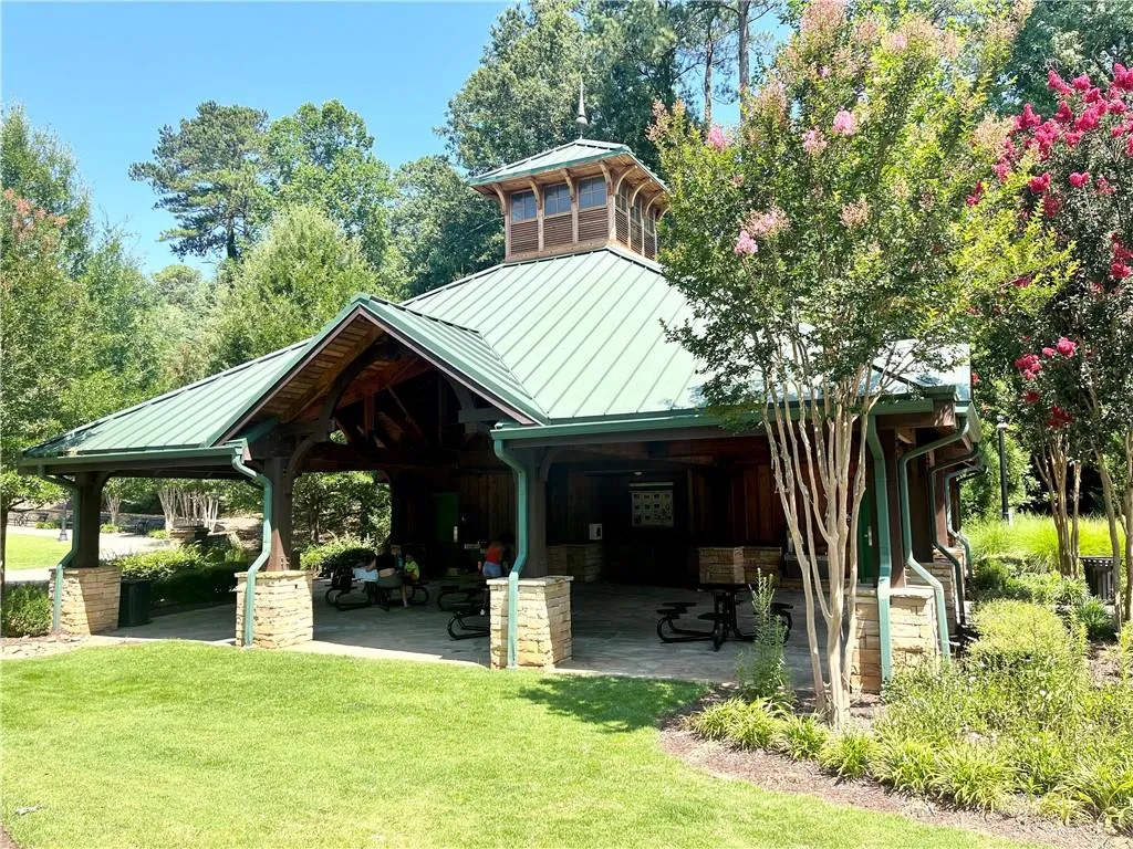 View of home's community with a gazebo, a patio area, and a yard