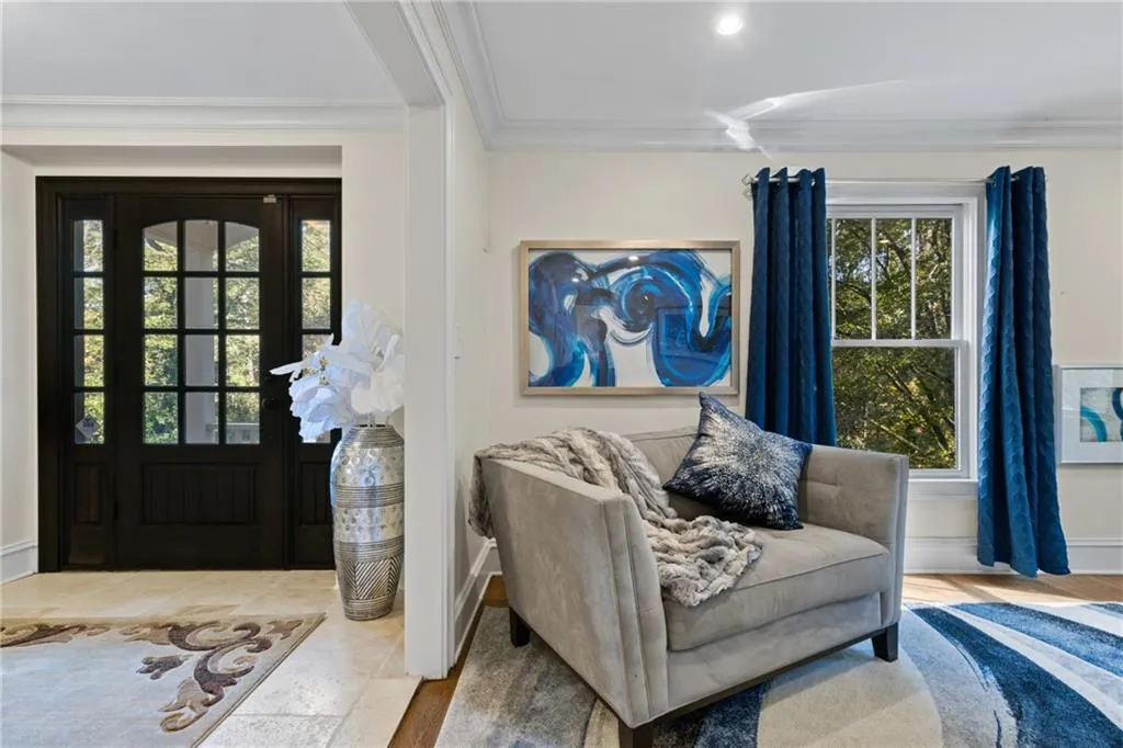 Entryway featuring crown molding and recessed lighting
